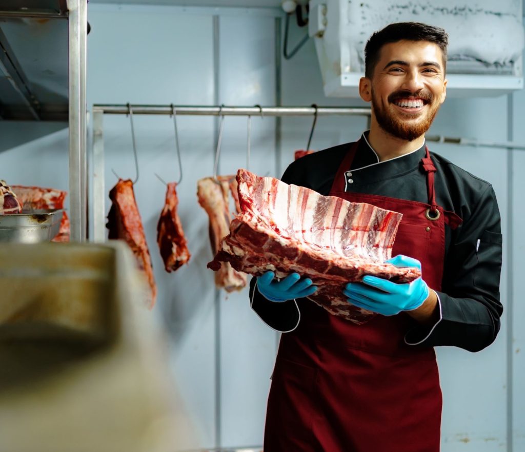 BUTCHER HOLDING FULL SIRLOIN